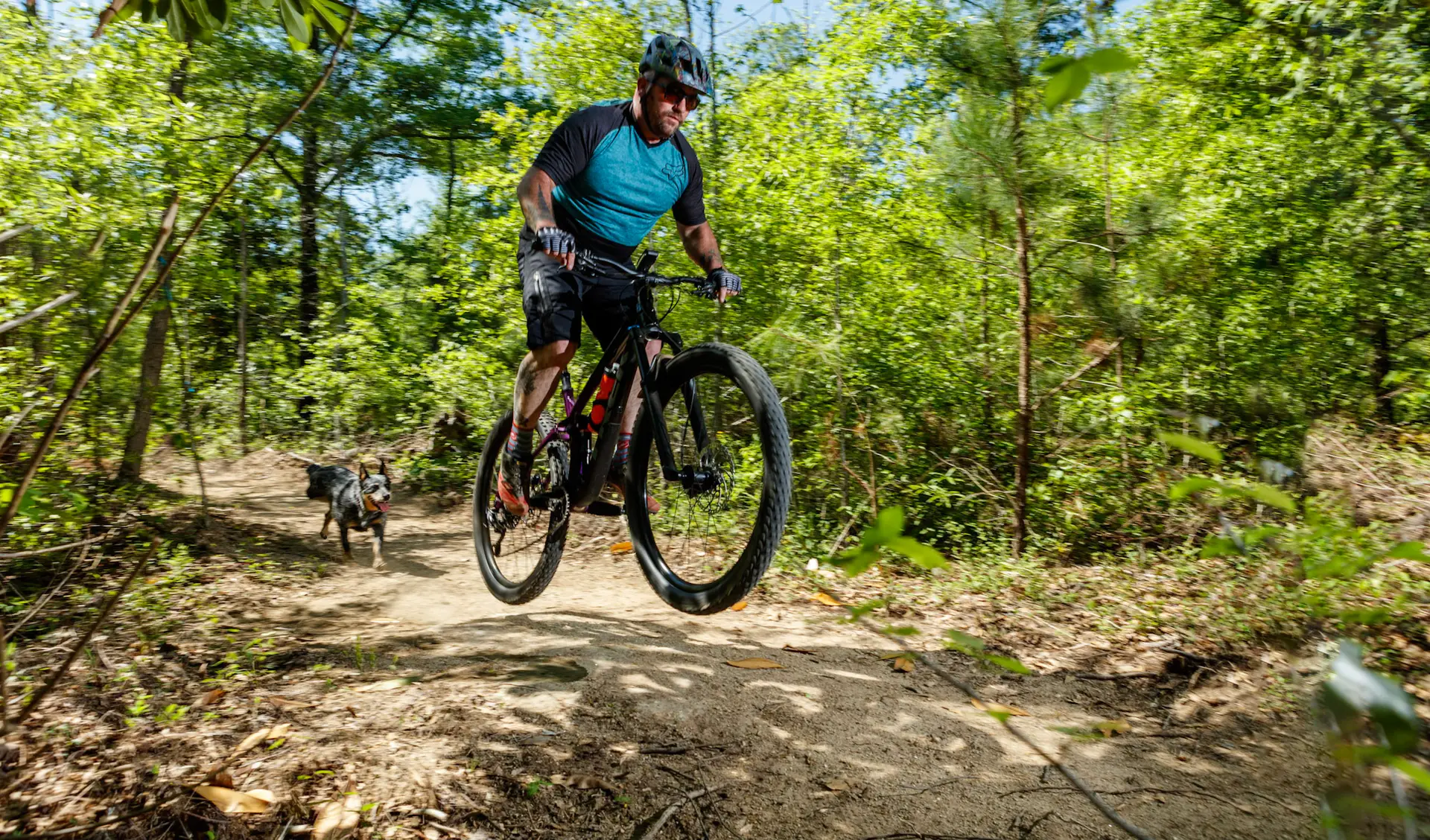 man biking with dog